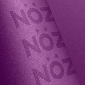 a close up view of the Noz packaging in the color purple