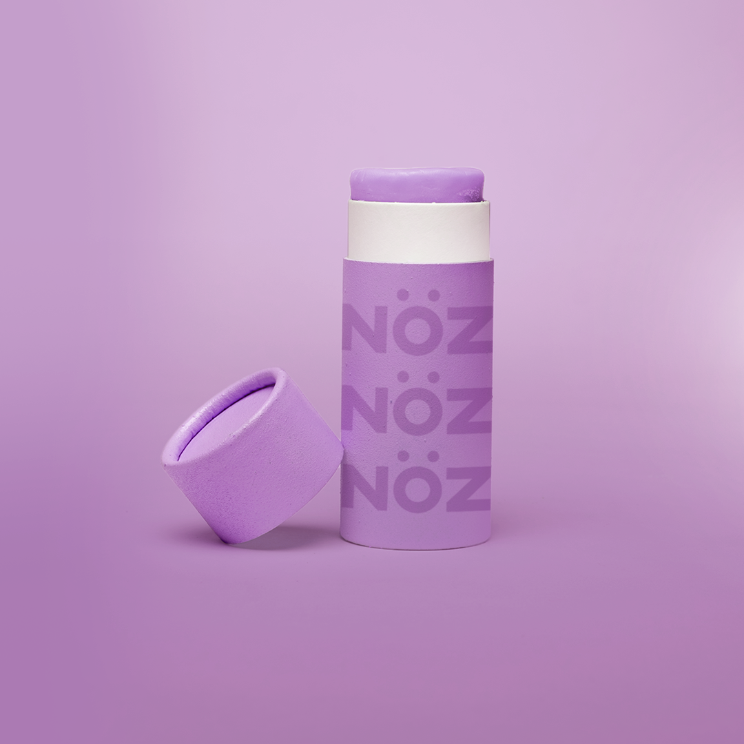 closeup image of noz neon sunscreen in the color purple