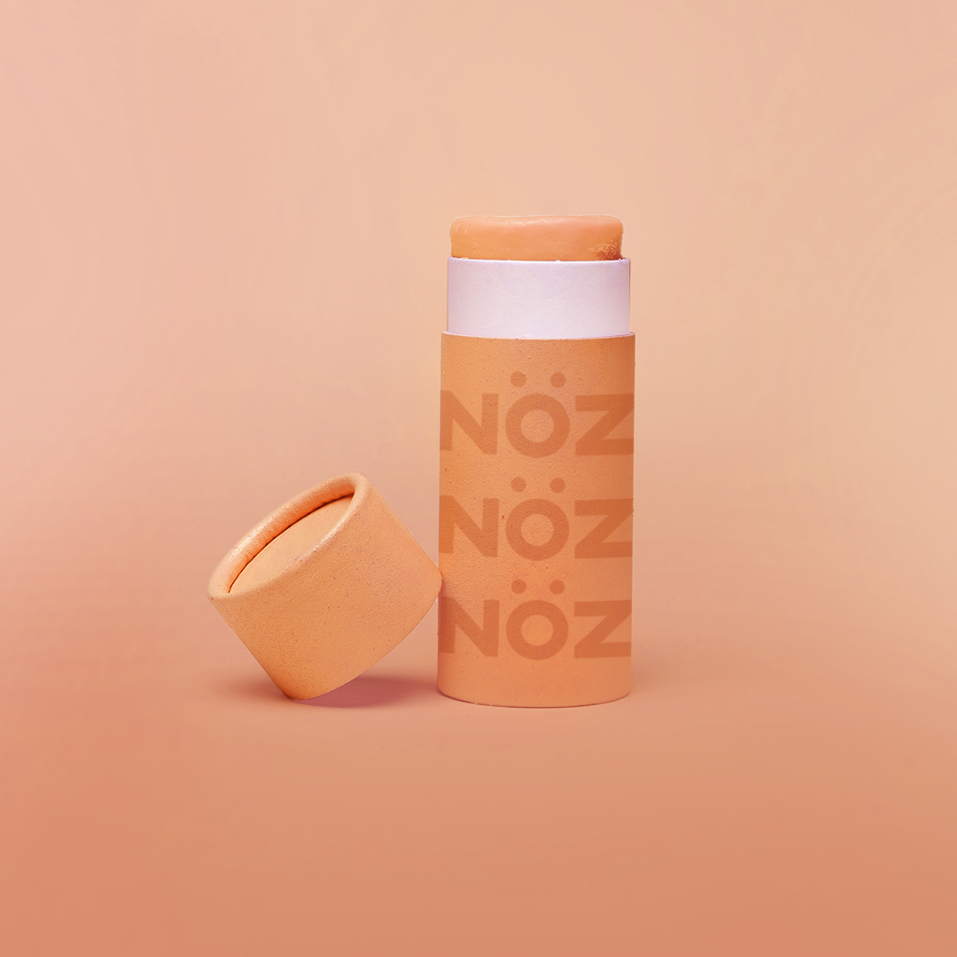 Closeup image of Noz neon sunscreen in the color orange