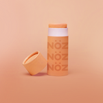 Load image into Gallery viewer, Closeup image of Noz neon sunscreen in the color orange
