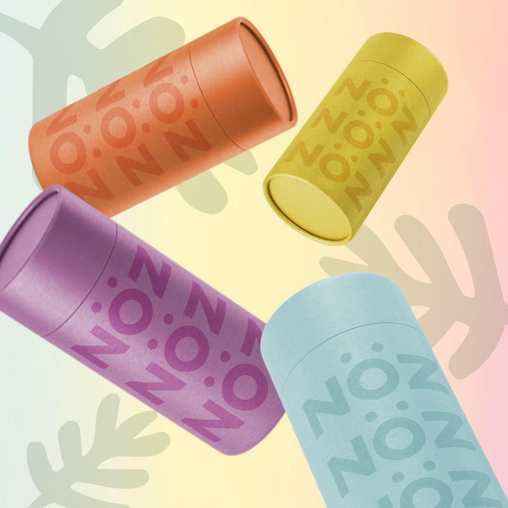 Noz cruelty-free sunscreen packaging in colors: red, orange, blue, and yellow